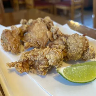 fried chicken with a lime wedge