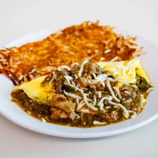 a plate of food with a side of hash browns