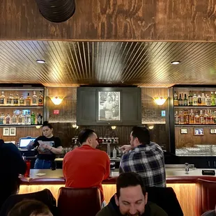 people sitting at the bar