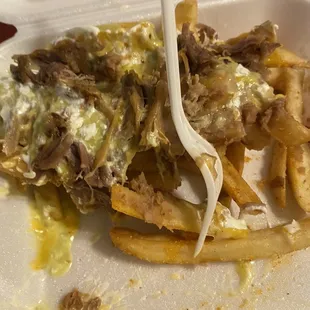 a plate of food with a fork in it