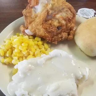 Fried chicken Potatoes gravy and corn.