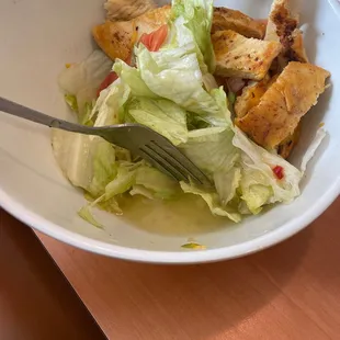 a salad with chicken and lettuce