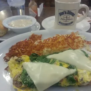 Ham, mushroom, spinach, and Swiss omelette with Hashbrowns and biscuit/gravy.