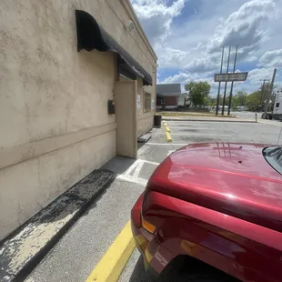 a red car parked in a parking lot