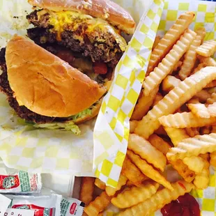 Double cheeseburger w/onion, tomato, mustard, lettuce, mayo, and ketchup.