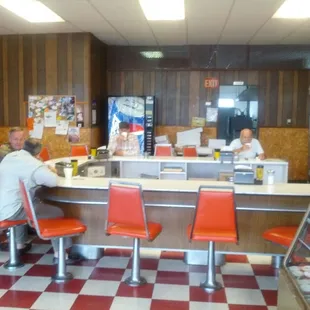 a man sitting at the counter
