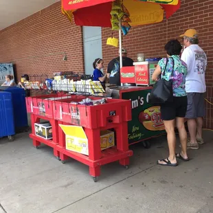 a man selling hot dogs