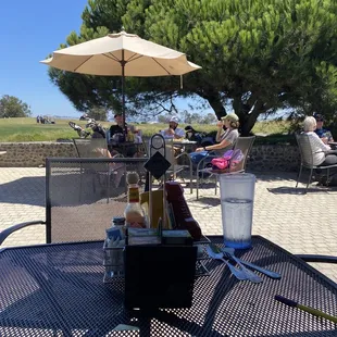 Exterior seating with shade on the backside of the restaurant