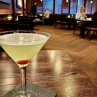a martini on a table