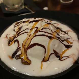 a dessert with ice cream and caramel