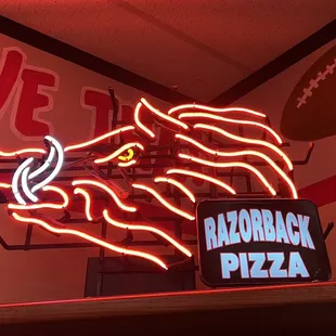 a neon sign of a lion