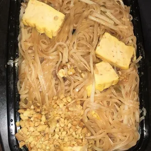 a plate of noodles and pineapples