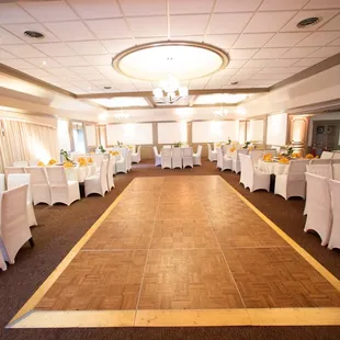 a banquet hall with tables and chairs