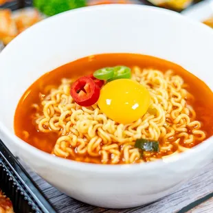 a bowl of ramen with an egg