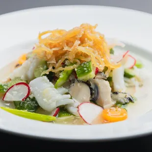 From our test kitchen - a cucumber salad tossed in refreshing chili garlic vinaigrette, featuring jellyfish, squid, and shrimp.