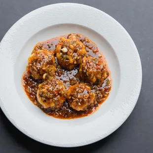Stuffed Shitake Mushroom - chopped fresh shrimp inside a whole shitake mushroom, dressed in a rich garlic chili bean sauce.