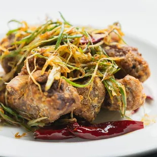 Our signature Jin Jia Spare Ribs are perfectly tender, juicy, and fall right off the bone. Braised pork ribs w/ Chinese Five Spice.