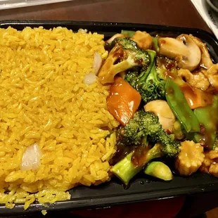 a plate of rice and vegetables