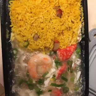 a tray of rice and shrimp