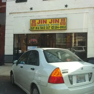 a car parked in front of the restaurant