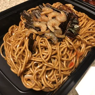 a plate of noodles and vegetables