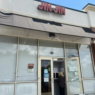 a woman entering a restaurant
