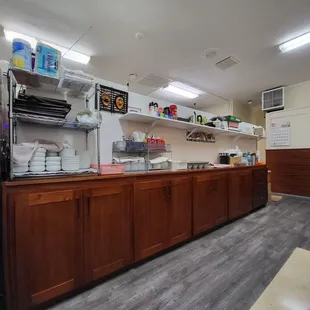 a kitchen with wooden cabinets and a refrigerator