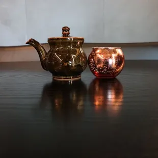  two teapots on a table