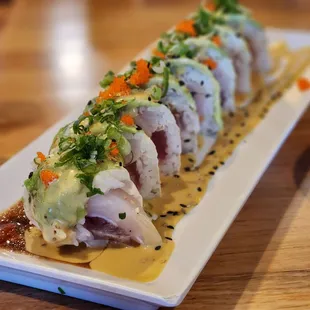 a sushi roll on a white plate