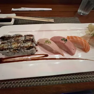 Eel cucumber roll, yellow tail, toro, salmon, and scallop.