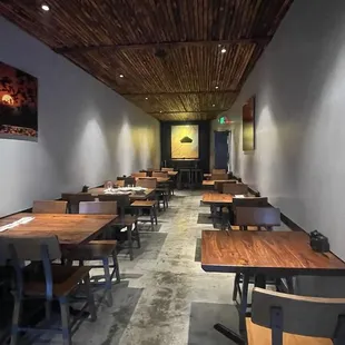 an empty restaurant with tables and chairs