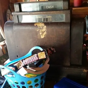 a blue basket with a guitar in it