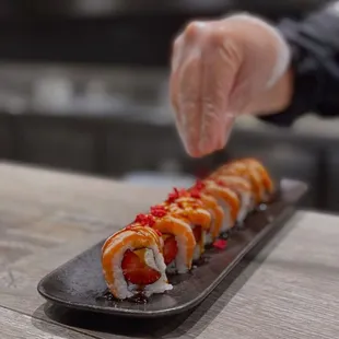 a sushi being prepared