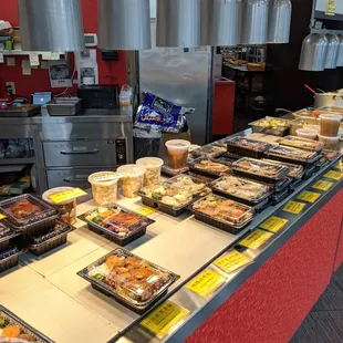 Deli area near the front. A variety of lunch boxes.