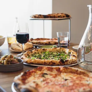 a table full of pizzas