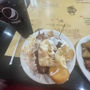 two plates of food and a drink