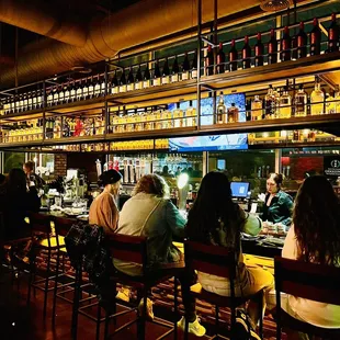 people sitting at the bar