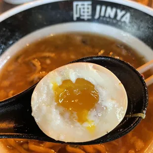 a bowl of ramen with a soft boiled egg
