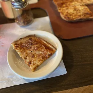 a slice of pizza on a plate