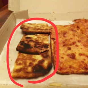 a slice of pizza in a box