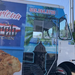 a food truck parked on the side of the road