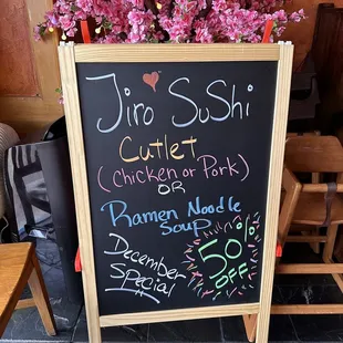 a chalk board with a bunch of flowers on it