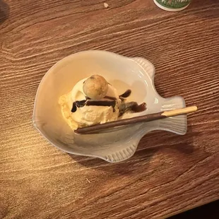 Yummy vanilla ice cream with chocolate syrup.