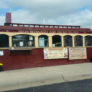 a red and yellow restaurant on a street corner