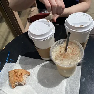 Blueberry scone (half-eaten), red velvet loaf, iced earl grey, mocha latte, and a plain latte