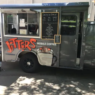 a coffee truck parked on the side of the street