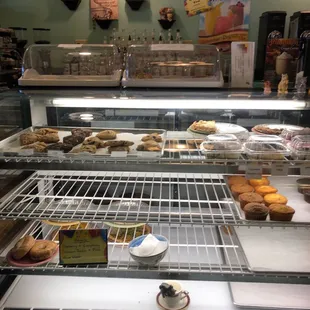 a display case filled with pastries