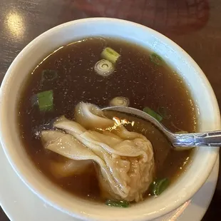 Wonton soup (with soy sauce I added )