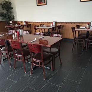 a dining room with tables and chairs