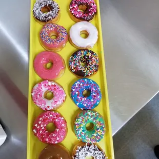 a tray of assorted donuts
